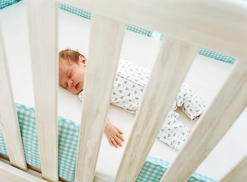 baby sleeping in cot