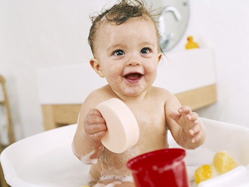 happy baby in shower