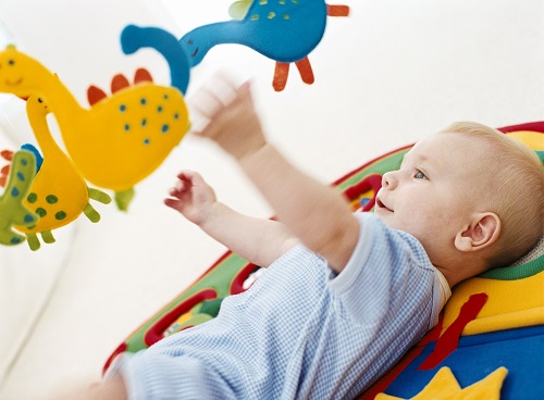 happy baby with toys